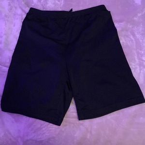 Black biker shorts; no pockets; fitted waist